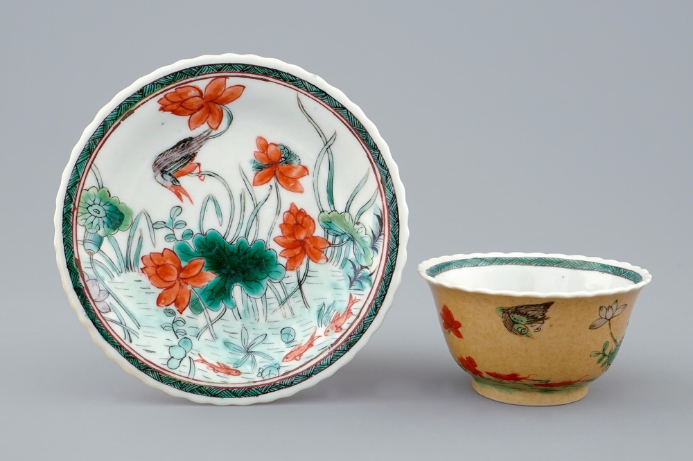 A Chinese famille verte and caf&eacute; au lait cup and saucer, Kangxi